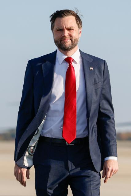 US Vice President JD Vance walks to speak to the media before boarding Air Force Two at Joint Base Andrews, Maryland on October 29, 2026. Vance is travelling to a midterm campaign rally in Texas. (Photo by Evan Vucci / POOL / AFP)