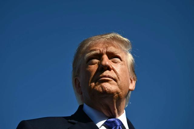 US President Donald Trump speaks to reporters before boarding Air Force One at Joint Base Andrews, Maryland on October 29, 2026. President Trump is travelling to South Carolina for a midterm campaign event. (Photo by Kent NISHIMURA / AFP)