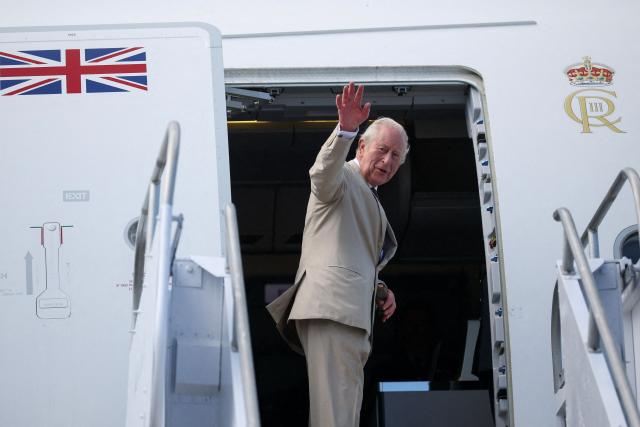 Britain's King Charles III boards his plane at Lynden Pindling International Airport in Nassau, Bahamas on October 29, 2026. King Charles III's Autumn Tour continues as he travels to Guyana next followed by Antigua and Barbuda. (Photo by Isabel Infantes / POOL / AFP)