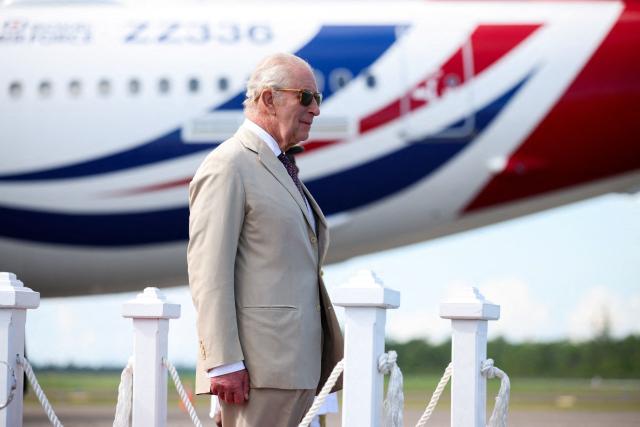 Britain's King Charles III before boarding his plane at Lynden Pindling International Airport in Nassau, Bahamas on October 29, 2026. King Charles III's Autumn Tour continues as he travels to Guyana next followed by Antigua and Barbuda. (Photo by Isabel Infantes / POOL / AFP)