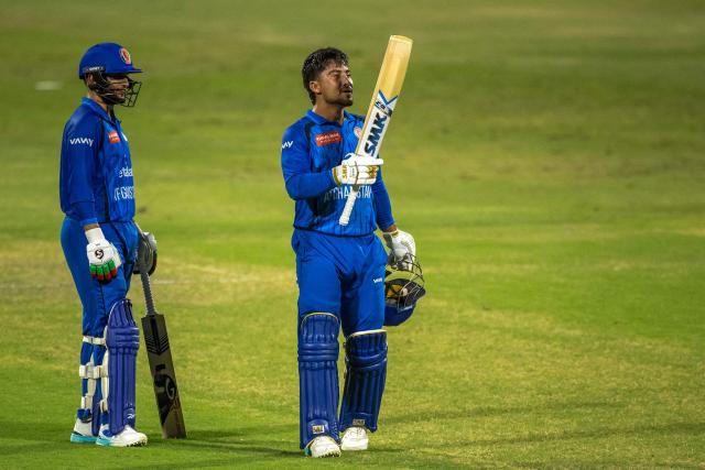 Afghanistan's Ijaz Ahmad Ahmadzai celebrates after reaching a half-century during the international T20 cricket match between Afghanistan and Zimbabwe at the Sharjah Cricket Stadium in Sharjah on October 29, 2026. (Photo by FADEL SENNA / AFP)