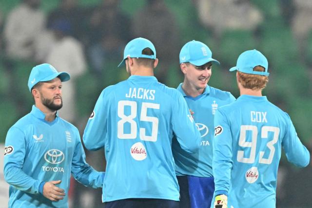 England's players celebrate their win in the end of the one-day international (ODI) tri-series cricket match between England and Sri Lanka at the Gaddafi stadium in Lahore on October 29, 2026. (Photo by ARIF ALI / AFP)