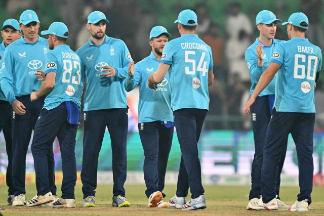 England's players celebrate their win in the end of the one-day international (ODI) tri-series cricket match between England and Sri Lanka at the Gaddafi stadium in Lahore on October 29, 2026. (Photo by ARIF ALI / AFP)