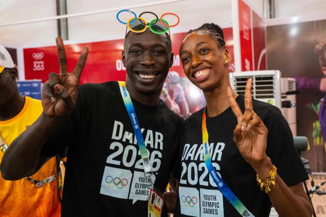 Senegal's Influencer and TikToker Khaby Lame (L) poses for a photograph with Senegal's athlete Saly Sarr (R) during their visit to the Olympic Village ahead of the Dakar 2026 Youth Olympic Games in Diamniadio, on October 29, 2026. (Photo by SEYLLOU / AFP)