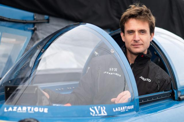 French skipper Tom Laperche poses for a photo session aboard his multihull Ultim class “SVR Lazartigue“ before the start of the 13th Route du Rhum Destination Guadeloupe on October 29, 2026. (Photo by Sebastien Salom-Gomis / AFP)