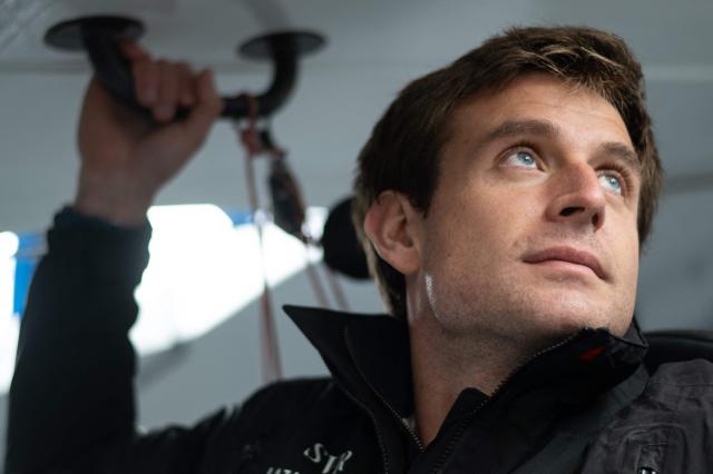 French skipper Tom Laperche poses for a photo session aboard his multihull Ultim class “SVR Lazartigue“ before the start of the 13th Route du Rhum Destination Guadeloupe on October 29, 2026. (Photo by Sebastien Salom-Gomis / AFP)