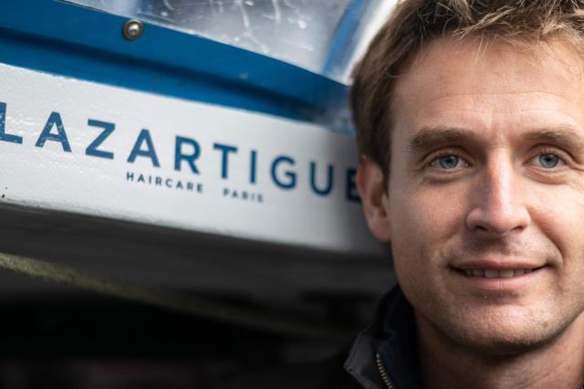 French skipper Tom Laperche poses for a photo session aboard his multihull Ultim class “SVR Lazartigue“ before the start of the 13th Route du Rhum Destination Guadeloupe on October 29, 2026. (Photo by Sebastien Salom-Gomis / AFP)