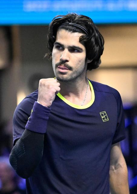 Spain’s Carlos Alcaraz reacts while playing against Georgia's Nikoloz Basilashvili (not pictured) at the Erste Bank Open 2026 ATP 500 tennis tournament in Vienna, Austria, on October 29, 2026. (Photo by HELMUT FOHRINGER / APA / AFP) / Austria OUT