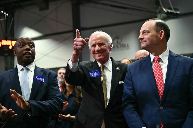 South Carolina Governor Henry McMaster (C) gestures alongside Senator Tim Scott (L), Republican from South Carolina, as US President Donald Trump speaks at a midterm campaign rally at the Rock Hill Sports & Event Center in Rock Hill, South Carolina on October 29, 2026. (Photo by Kent NISHIMURA / AFP)