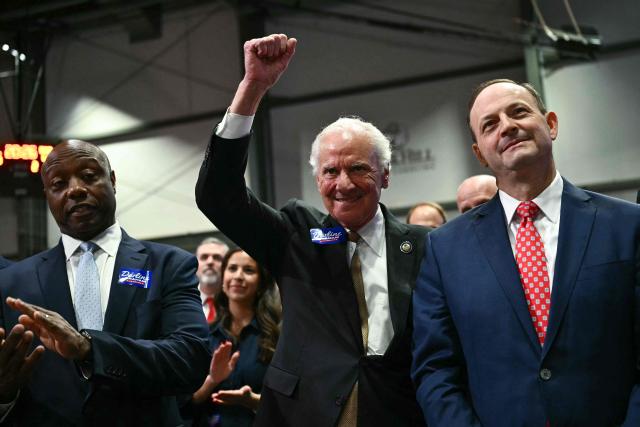 South Carolina Governor Henry McMaster (C) gestures alongside Senator Tim Scott (L), Republican from South Carolina, as US President Donald Trump speaks at a midterm campaign rally at the Rock Hill Sports & Event Center in Rock Hill, South Carolina on October 29, 2026. (Photo by Kent NISHIMURA / AFP)