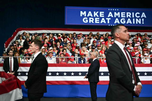US Secret Service agents look on as US President Donald Trump speaks during a midterm campaign rally at the Rock Hill Sports & Event Center in Rock Hill, South Carolina on October 29, 2026. (Photo by Kent NISHIMURA / AFP)