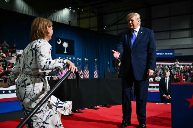 US President Donald Trump welcomes Senator Darline Graham, Republican from South Carolina, to the stage to speak during a midterm campaign rally at the Rock Hill Sports & Event Center in Rock Hill, South Carolina on October 29, 2026. (Photo by Kent NISHIMURA / AFP)