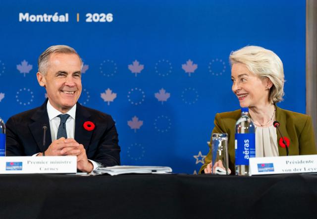 (L/R) Canada's Prime Minister Mark Carney and President of the European Commission Ursula von der Leyen speak during a roundtable event with business leaders during the 21st EU-Canada summit in Montreal, Quebec, Canada on October 29, 2026. The EU and Canada want to bring their relationship to the "highest level possible" as they face a "world of growing rivalries," said Ursula von der Leyen, the 27-nation bloc's chief said Thursday ahead of a meeting with Canadian leader Mark Carney. Brussels and Ottawa are to lay the groundwork for an ever-closer partnership at a two-day summit in Montreal, as they navigate uncertain ties with the United States and China. (Photo by Christopher Katsarov / POOL / AFP)