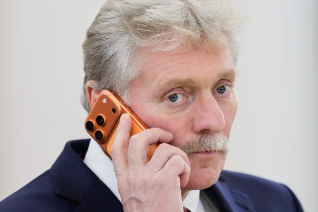 Kremlin Spokesman Dmitry Peskov speaks on a mobile phone as he attends a meeting between Russian and Congolese presidents on the sidelines of the Russia-Africa summit in Moscow on October 29, 2026. (Photo by Pavel Bednyakov / POOL / AFP)
