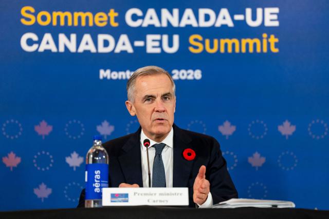 Canada's Prime Minister Mark Carney speaks during a roundtable event with business leaders during the 21st EU-Canada summit in Montreal, Quebec, Canada on October 29, 2026. The EU and Canada want to bring their relationship to the "highest level possible" as they face a "world of growing rivalries," said Ursula von der Leyen, the 27-nation bloc's chief said Thursday ahead of a meeting with Canadian leader Mark Carney. Brussels and Ottawa are to lay the groundwork for an ever-closer partnership at a two-day summit in Montreal, as they navigate uncertain ties with the United States and China. (Photo by Christopher Katsarov / POOL / AFP)