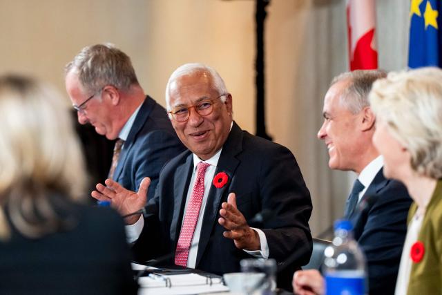 European Council President Antonio Costa (2L) speaks alongside Canada's Prime Minister Mark Carney (2R) and President of the European Commission Ursula von der Leyen (R) during a roundtable with business leaders during the 21st EU-Canada summit in Montreal, Quebec, Canada on October 29, 2026. The EU and Canada want to bring their relationship to the "highest level possible" as they face a "world of growing rivalries," the 27-nation bloc's chief said Thursday ahead of a meeting with Canadian leader Mark Carney. Brussels and Ottawa are to lay the groundwork for an ever-closer partnership at a two-day summit in Montreal, as they navigate uncertain ties with the United States and China. (Photo by Christopher Katsarov / POOL / AFP)