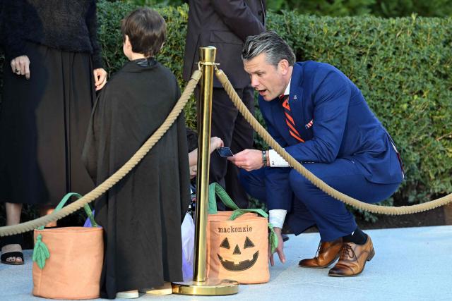 US Secretary of Defense Pete Hegseth interacts with children attending a Halloween party at the White House in Washington, DC, on October 29, 2026. (Photo by SAUL LOEB / AFP)