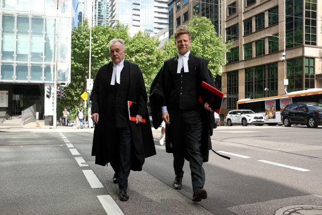 Brendan Kissane (L), Victoria's Director of Public Prosecutions, arrives at the Supreme Court of Victoria in Melbourne on October 30, 2026 ahead of the judgement in Erin Patterson's appeal. Australian mushroom murderer Erin Patterson lost a bid to overturn her convictions on Friday, failing to prove she was wrongfully blamed for killing three people with a poisoned lunch. (Photo by Martin KEEP / AFP)