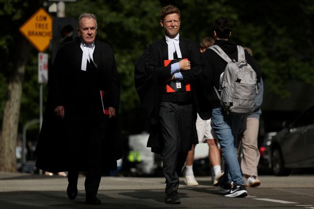 Brendan Kissane (L), Victoria's Director of Public Prosecutions, arrives at the Supreme Court of Victoria in Melbourne on October 30, 2026 ahead of the judgement in Erin Patterson's appeal. Australian mushroom murderer Erin Patterson lost a bid to overturn her convictions on Friday, failing to prove she was wrongfully blamed for killing three people with a poisoned lunch. (Photo by Martin KEEP / AFP)