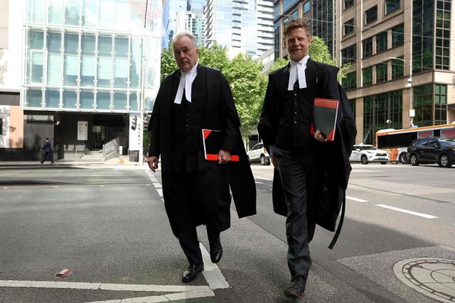Brendan Kissane (L), Victoria's Director of Public Prosecutions, arrives at the Supreme Court of Victoria in Melbourne on October 30, 2026 ahead of the judgement in Erin Patterson's appeal. Australian mushroom murderer Erin Patterson lost a bid to overturn her convictions on Friday, failing to prove she was wrongfully blamed for killing three people with a poisoned lunch. (Photo by Martin KEEP / AFP)