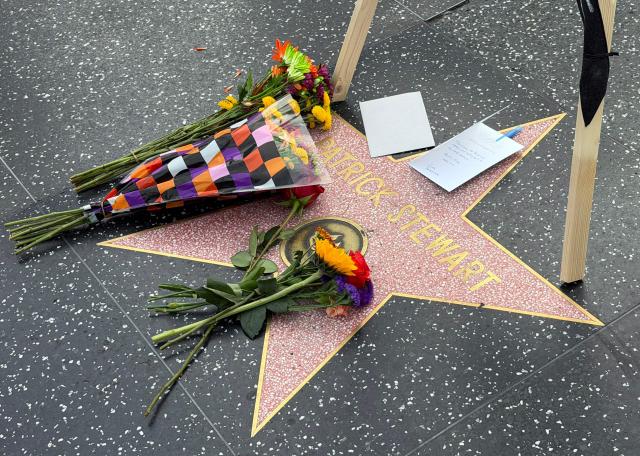 Flowers are placed on Sir Patrick Stewart's star on the Hollywood Walk of Fame following the announcement of his death, in Hollywood, California, on October 29, 2026. Patrick Stewart, the British Shakespearean actor who became a Hollywood megastar through "Star Trek" and the "X-Men" franchises has died, an official statement said on October 29. "We announce with great sorrow the passing of Sir Patrick Stewart yesterday at his home in Los Angeles, in the loving care of his beloved wife Sunny, following a brief and poignant journey with Alzheimer's Disease and Lewy Body Dementia," the statement said. (Photo by Chris DELMAS / AFP)