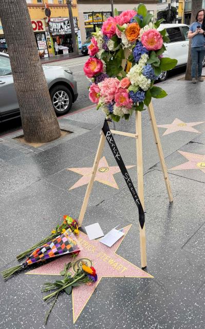Flowers and a funeral wreath are placed on Sir Patrick Stewart's star on the Hollywood Walk of Fame following the announcement of his death, in Hollywood, California, on October 29, 2026. Patrick Stewart, the British Shakespearean actor who became a Hollywood megastar through "Star Trek" and the "X-Men" franchises has died, an official statement said on October 29. "We announce with great sorrow the passing of Sir Patrick Stewart yesterday at his home in Los Angeles, in the loving care of his beloved wife Sunny, following a brief and poignant journey with Alzheimer's Disease and Lewy Body Dementia," the statement said. (Photo by Chris DELMAS / AFP)