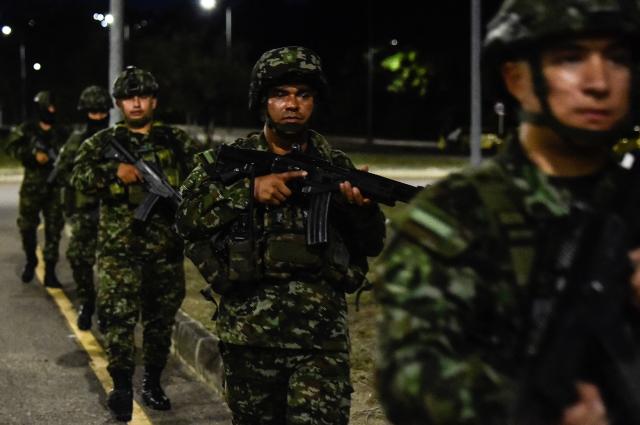 Colombian soldiers patrol near the Atanasio Girardot International Bridge on the Colombia-Venezuela border in Cucuta, Norte de Santander, Colombia on October 29, 2026. Colombian President Abelardo de la Espriella on October 29, ordered the temporary "militarization" of a city bordering Venezuela after a wave of recent violence linked to criminal groups. Over the past few days in Cucuta, the capital of the Norte de Santander department, a mayoral candidate was murdered and a bombing left four police officers injured, according to the local government. (Photo by Schneyder Mendoza / AFP)