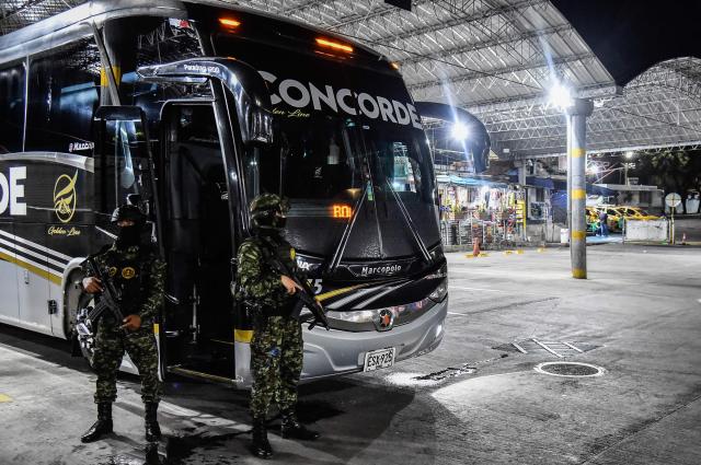 Colombian soldiers stand guard at the Transport Terminal in Cucuta, Norte de Santander, Colombia, on October 29, 2026. Colombian President Abelardo de la Espriella on October 29, ordered the temporary "militarization" of a city bordering Venezuela after a wave of recent violence linked to criminal groups. Over the past few days in Cucuta, the capital of the Norte de Santander department, a mayoral candidate was murdered and a bombing left four police officers injured, according to the local government. (Photo by Schneyder Mendoza / AFP)