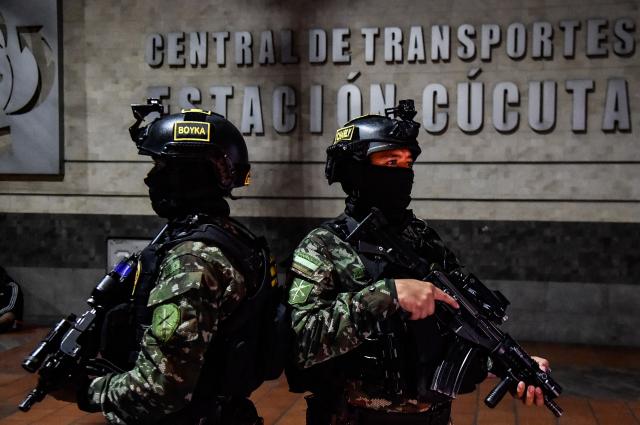 Colombian soldiers stand guard at the Transport Terminal in Cucuta, Norte de Santander, Colombia, on October 29, 2026. Colombian President Abelardo de la Espriella on October 29, ordered the temporary "militarization" of a city bordering Venezuela after a wave of recent violence linked to criminal groups. Over the past few days in Cucuta, the capital of the Norte de Santander department, a mayoral candidate was murdered and a bombing left four police officers injured, according to the local government. (Photo by Schneyder Mendoza / AFP)