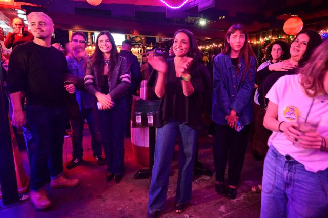 Los Angeles Mayoral Democratic candidate Nithya Raman meets with Latino voters at La Cita Bar in Los Angeles on October 29, 2026. Raman is facing incumbant Los Angeles Mayor Karen Bass in the November 3 election. (Photo by Frederic J. BROWN / AFP)