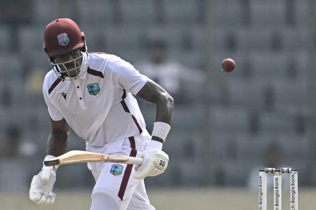 West Indies' Justin Greaves watches the ball after playing a shot during the third day of the first test cricket match between Bangladesh and West Indies at the Sher-e-Bangla National Stadium in Mirpur on October 30, 2026. (Photo by Salahuddin Ahmed / AFP)