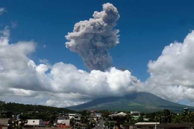 Smoke billows into the sky as Mayon volcano erupts as seen from Legaspi City, Albay province, south of Manila on October 30, 2026. One of the Philippines' most active volcanoes fired a dark column of ash thousands of metres into the sky October 30 in a "moderately explosive eruption" lasting just under six minutes, the state seismology office said. (Photo by Zarlian Sayat / AFP)