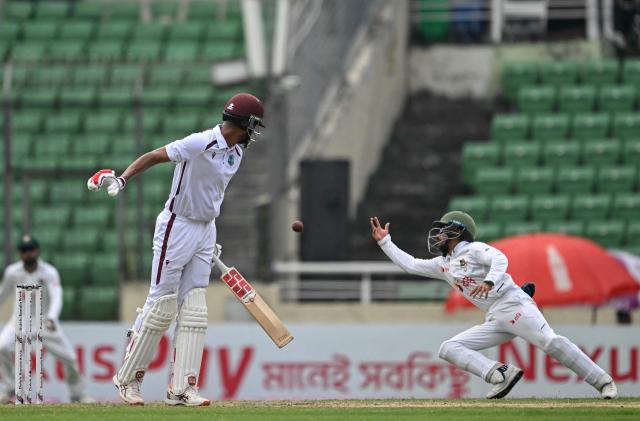Bangladesh's Mominul Haque (R) drops a catch of West Indies' captain Roston Chase during the third day of the first test cricket match between Bangladesh and West Indies at the Sher-e-Bangla National Stadium in Mirpur on October 30, 2026. (Photo by Salahuddin Ahmed / AFP)