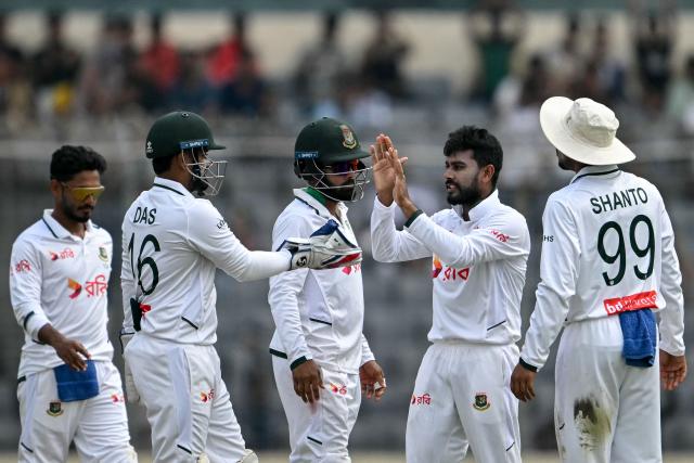 Bangladesh's Mehidy Hasan Miraz (2R) celebrates with teammates after taking the wicket of West Indies' Joshua Bishop during the third day of the first test cricket match between Bangladesh and West Indies at the Sher-e-Bangla National Stadium in Mirpur on October 30, 2026. (Photo by Salahuddin AHMED / AFP)