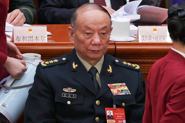 (FILES) Chinese Central Military Commission Vice Chairman Zhang Shengmin attends the opening session of the National People's Congress (NPC) at the Great Hall of the People in Beijing on March 5, 2026. Top Chinese Communist Party officials moved to tighten internal discipline during a key meeting that concluded on October 29, with analysts saying the measures appeared aimed at paving the way for President Xi Jinping to extend his rule. Anti-corruption chief Zhang Shengmin, who serves as vice chairman of the Central Military Commission (CMC), was promoted to the Politburo, the country's top decision-making body. (Photo by FLORENCE LO / POOL / AFP)