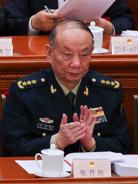(FILES) Chinese Central Military Commission Vice Chairman Zhang Shengmin attends the opening session of the National People's Congress (NPC) at the Great Hall of the People in Beijing on March 5, 2026. Top Chinese Communist Party officials moved to tighten internal discipline during a key meeting that concluded on October 29, with analysts saying the measures appeared aimed at paving the way for President Xi Jinping to extend his rule. Anti-corruption chief Zhang Shengmin, who serves as vice chairman of the Central Military Commission (CMC), was promoted to the Politburo, the country's top decision-making body. (Photo by Florence Lo / POOL / AFP)