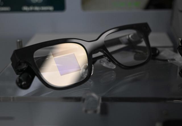 A pair of smart glasses is pictured on display at the Eyedaq eyewear store in Seoul on October 30, 2026. South Korea will file criminal complaints against students caught cheating with smart glasses and toughen penalties for their use, a government official told AFP on October 30. (Photo by Jung Yeon-je / AFP)