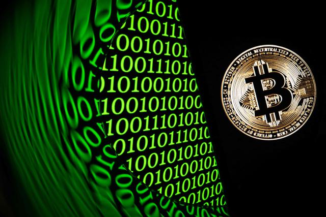 (FILES) This illustration photograph taken in Mulhouse, eastern France on February 11, 2025, shows the bitcoin logo displayed on a smartphone. Bitcoin fell sharply Thursday after several sources reported a major hack of the cryptocurrency platform Binance, which said it was investigating without confirming any kind of cyberattack. (Photo by SEBASTIEN BOZON / AFP)