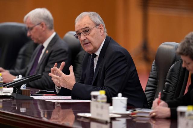 Switzerland's President Guy Parmelin (C) attends a meeting with Chinese President Xi Jinping at the Great Hall of the People in Beijing on October 30, 2026. (Photo by Kai Naito / POOL / AFP)