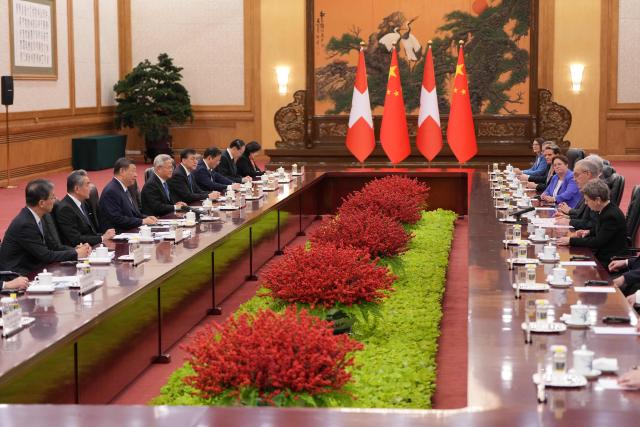 Chinese President Xi Jinping (3rd L) and Switzerland's President Guy Parmelin (2nd R) attend a meeting with Chinese President Xi Jinping at the Great Hall of the People in Beijing on October 30, 2026. (Photo by Kai Naito / POOL / AFP)