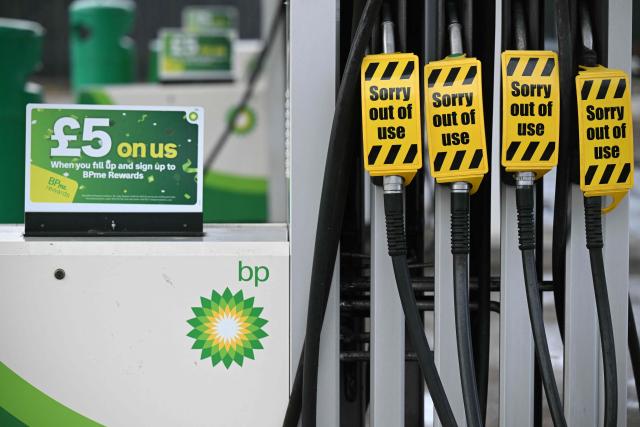 (FILES) Fuel pumps are seen, out of use at a BP petrol station in Fenay Bridge, near Huddersfield, northern England on October 23, 2026. British energy giant BP said Friday, October 30, that its net profit quadrupled in the third quarter as the Middle East war disrupted oil and gas supplies and sent prices surging. (Photo by Oli SCARFF / AFP)
