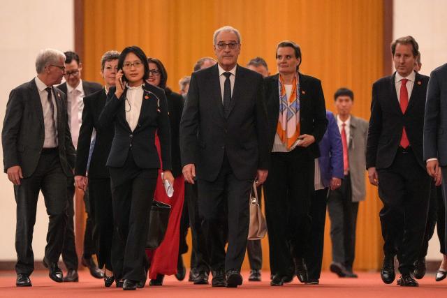Switzerland's President Guy Parmelin (C) heads to a meeting with Chinese President Xi Jinping at the Great Hall of the People in Beijing on October 30, 2026. (Photo by Kai Naito / POOL / AFP)