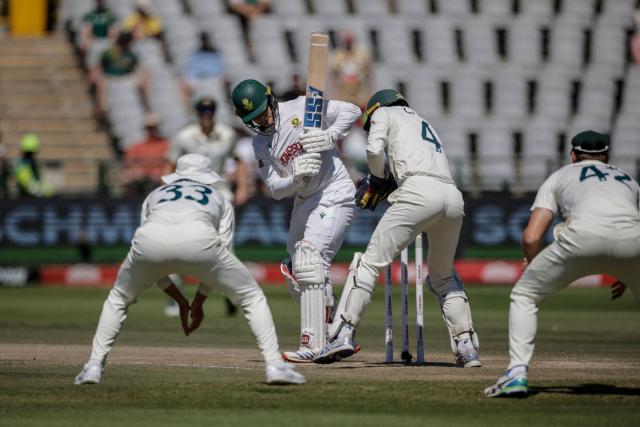 South Africa's Ryan Rickelton (2nd L) reacts as Australia's Alex Carey (2nd R) fields a ball on day four of the third Test match between South Africa and Australia at Newlands stadium in Cape Town on October 30, 2026. (Photo by Marco Longari / AFP)