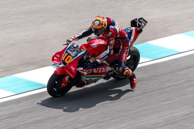 Honda HRC Castrol's Italian rider Luca Marini brakes before taking a corner during a practice session ahead of the MotoGP Malaysian Grand Prix at the Sepang International Circuit in Sepang on October 30, 2026. (Photo by Mohd Rasfan / AFP)