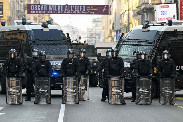 Italy's military police Carabinieri secure a street during a demonstration part of a nationwide day of strikes and protests as school and university students demand more funding for schools and support for housing, in Milan, northern Italy on October 30, 2026. Students have been protesting for weeks, setting up tent camps and occupying schools to make their demands heard, matching similar movements across the border in France. The Italian protests have taken place alongside those of truck drivers and farmers over the spike in fuel prices and the cost of living, as well as rising defence spending. (Photo by Stefano RELLANDINI / AFP)