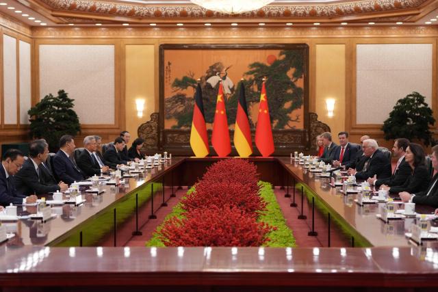Chinese President Xi Jinping (3rd-L) and Germany’s President Frank-Walter Steinmeier (4t-R) attend a meeting at the Great Hall of the People in Beijing on October 30, 2026. (Photo by Kai Naito / POOL / AFP)