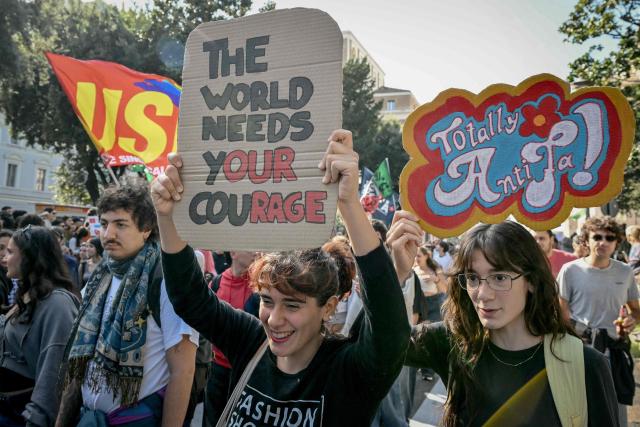 People take part in a demonstration part of a nationwide day of strikes and protests as school and university students demand more funding for schools and support for housing in Rome on October 30, 2026. Students have been protesting for weeks, setting up tent camps and occupying schools to make their demands heard, matching similar movements across the border in France. The Italian protests have taken place alongside those of truck drivers and farmers over the spike in fuel prices and the cost of living, as well as rising defence spending. (Photo by Alberto PIZZOLI / AFP)