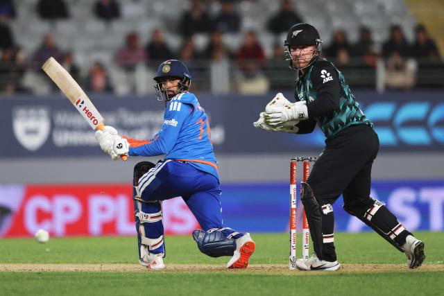 India's Prince Yadav bats watched by New Zealand's Tim Seifert (R) during the 4th T20 cricket match between New Zealand and India at Eden Park in Auckland on October 30, 2026. (Photo by Michael Bradley / AFP)