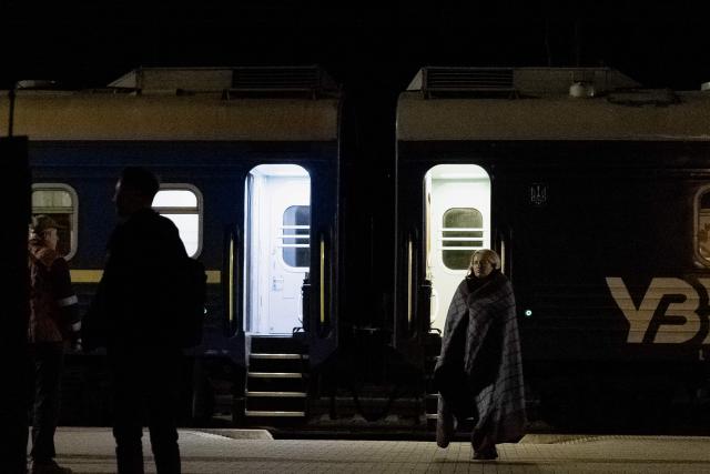 Passengers wait during the evacuation from the train due to the threat of a Russian drone during the Kharkiv-Kyiv route on October 21, 2026, amid the Russian invasion of Ukraine. The approaching winter - many Ukrainians fear will be the harshest since the start of the war - is expected to make train travel more difficult still. Authorities are warning of possible disruptions to electricity, water and heating as Russia's attacks on energy infrastructure intensify. And as temperatures drop below freezing, evacuation will become more challenging. (Photo by Tetiana DZHAFAROVA / AFP)
