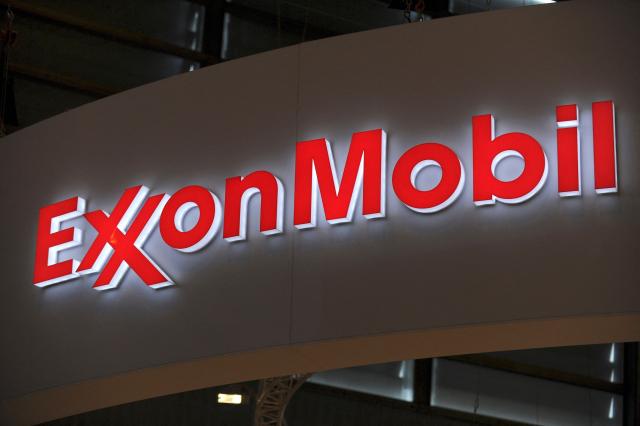 (FILES) A picture shows the logo of US oil and gas giant ExxonMobil during the World Gas Conference exhibition in Paris on June 2, 2015. ExxonMobil reported on October 30, 2026 that third-quarter profits more than doubled to $15.4 billion, as it benefited from higher oil prices and refining margins due to the US-Iran war. (Photo by ERIC PIERMONT / AFP)